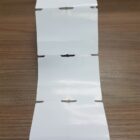 ETIQUETA 50X75/2 TAG/ADESIVA/SERRILHA/C.TARJA/F.CIMA/ARRED /SERRILHADA-32MTS